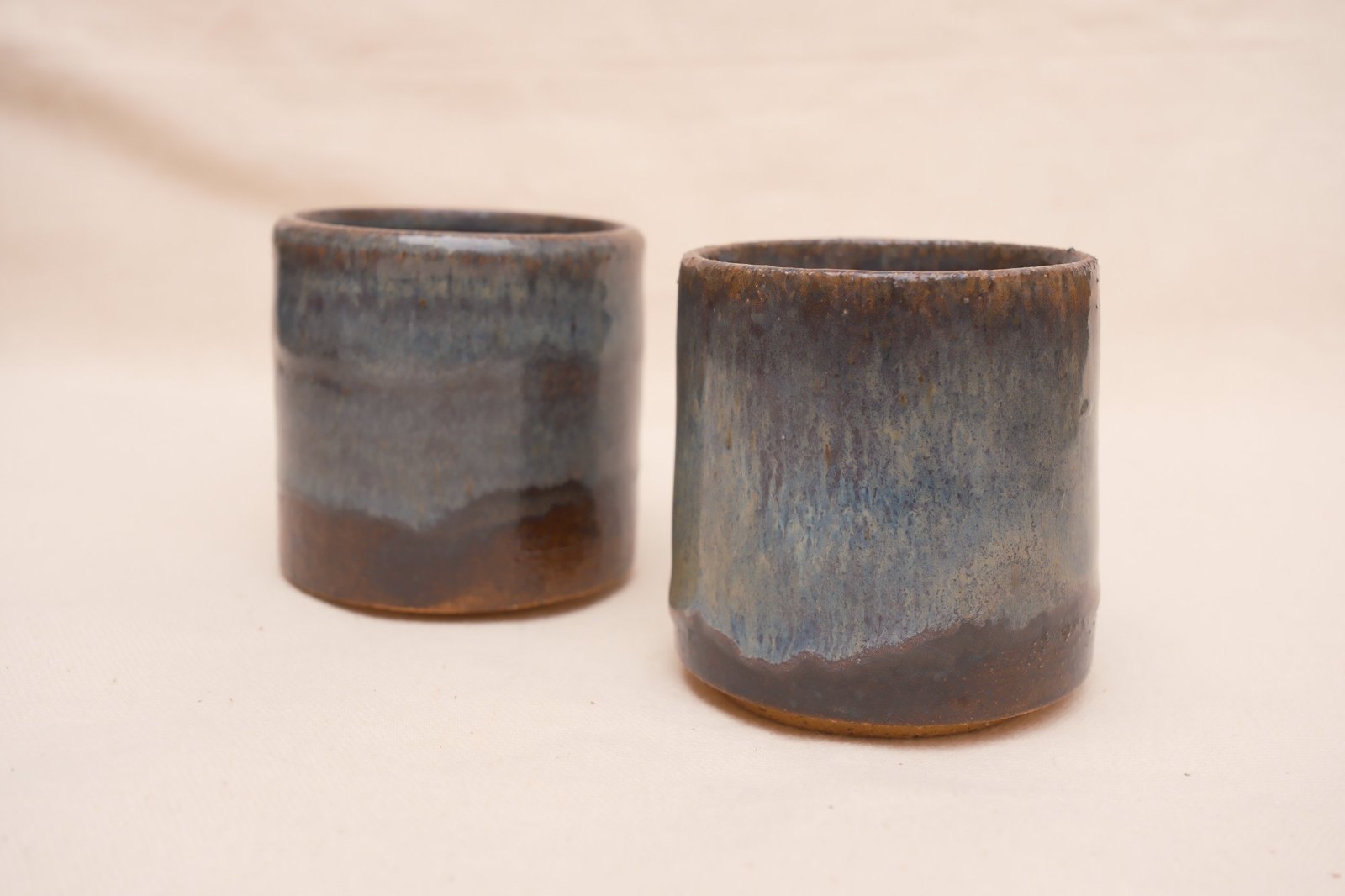 Both espresso cups side by side on linen
