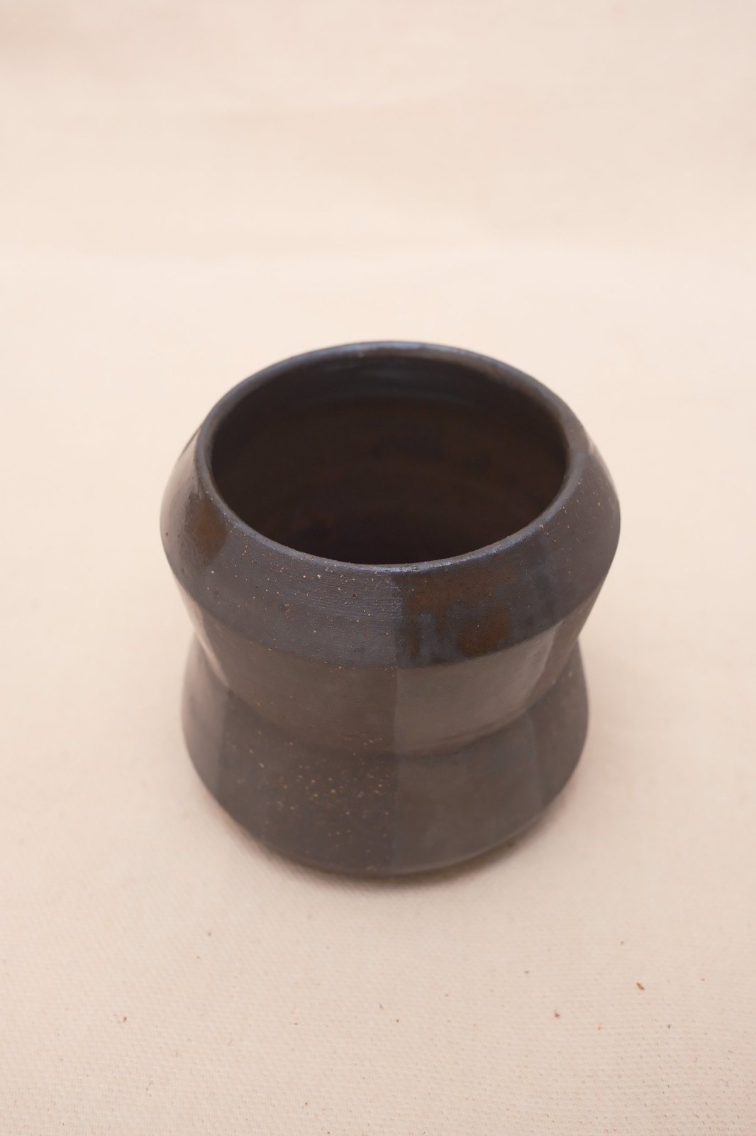 The cup from above, showing the faceted shoulder