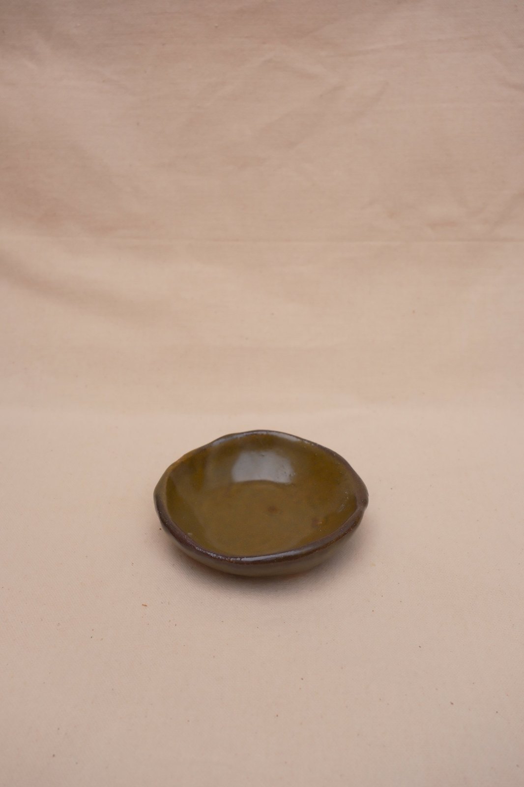 The pinch dish small on a linen backdrop