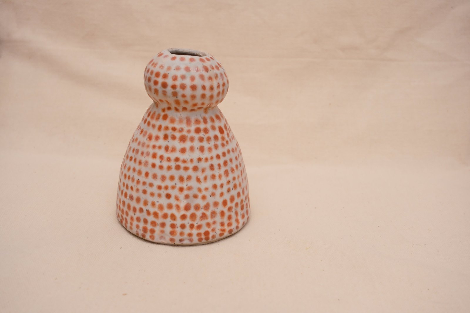 The vase on linen from a little further back