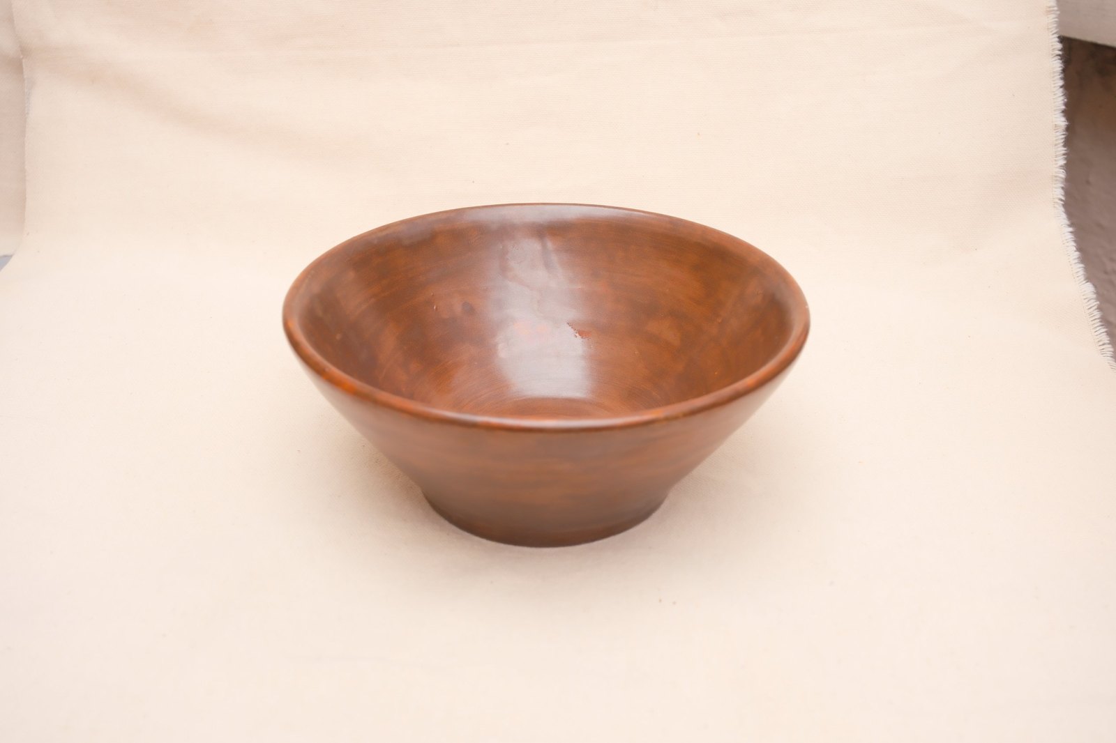The bowl from above at an angle on linen