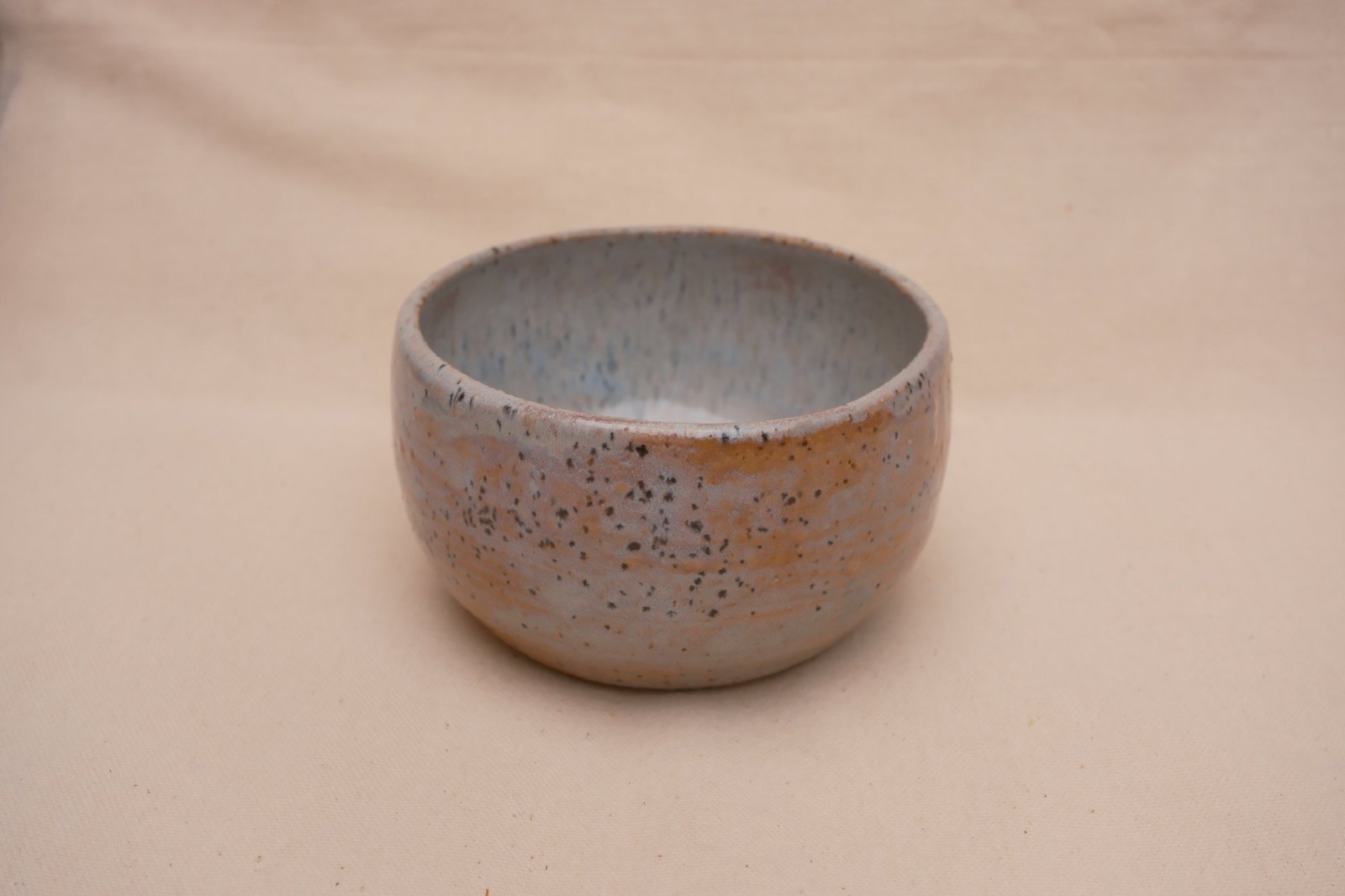 The trinket bowl from a raised angle on linen
