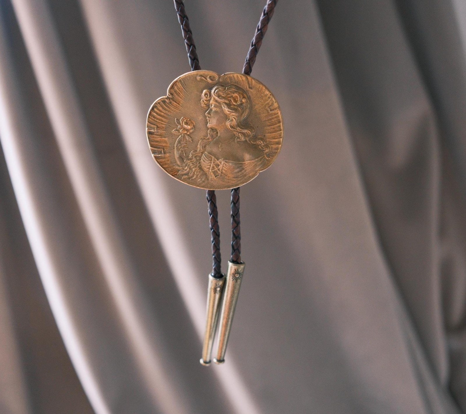 Rose Hour bolo tie: antique Edwardian gilt brooch of a woman holding a rose, on dark braided leather