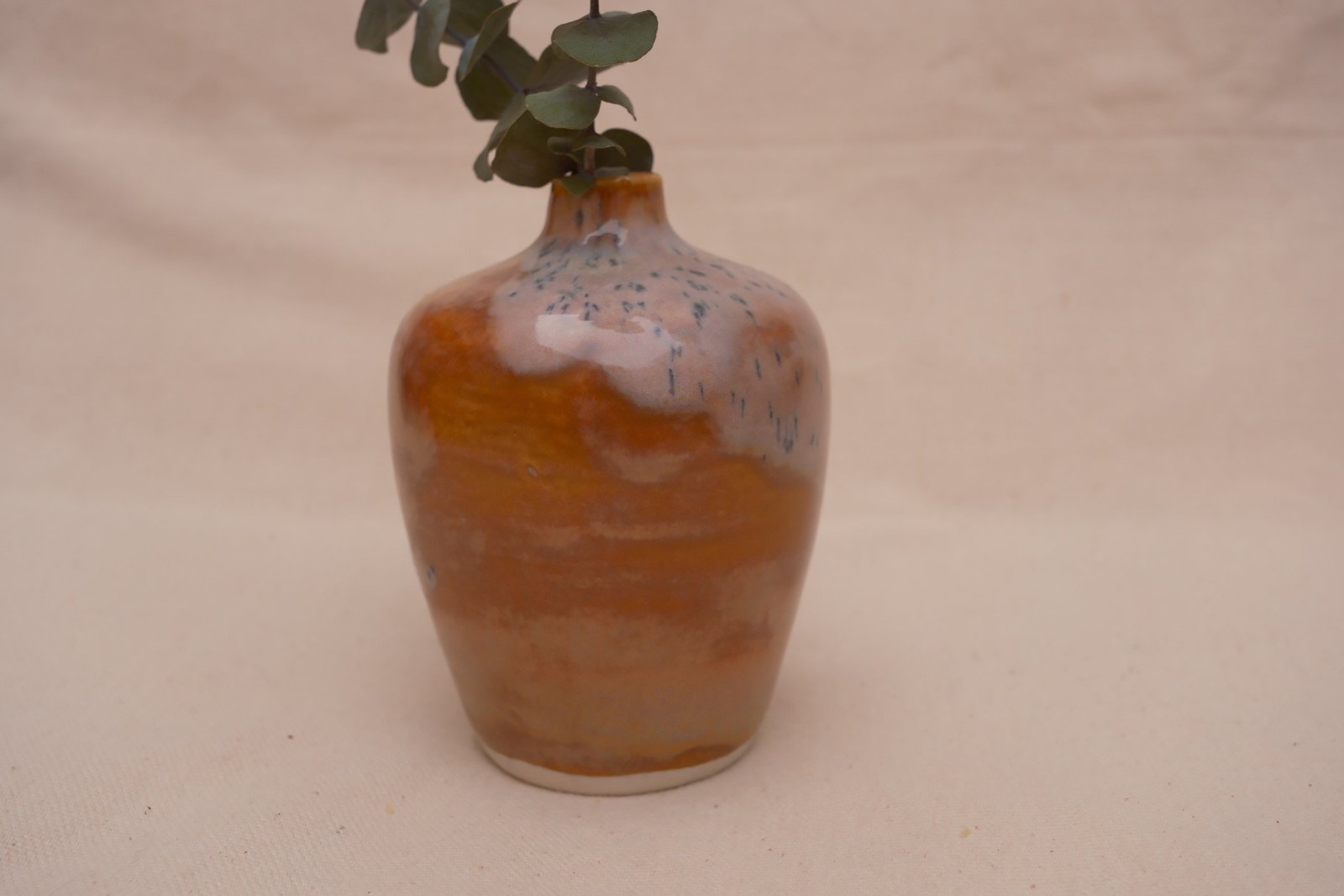 The vase from the back, mostly warm orange