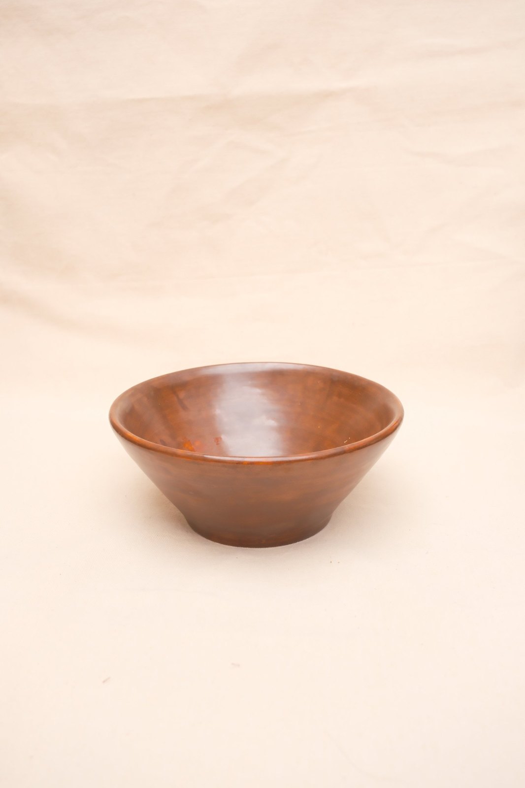 The bowl small in the frame on linen