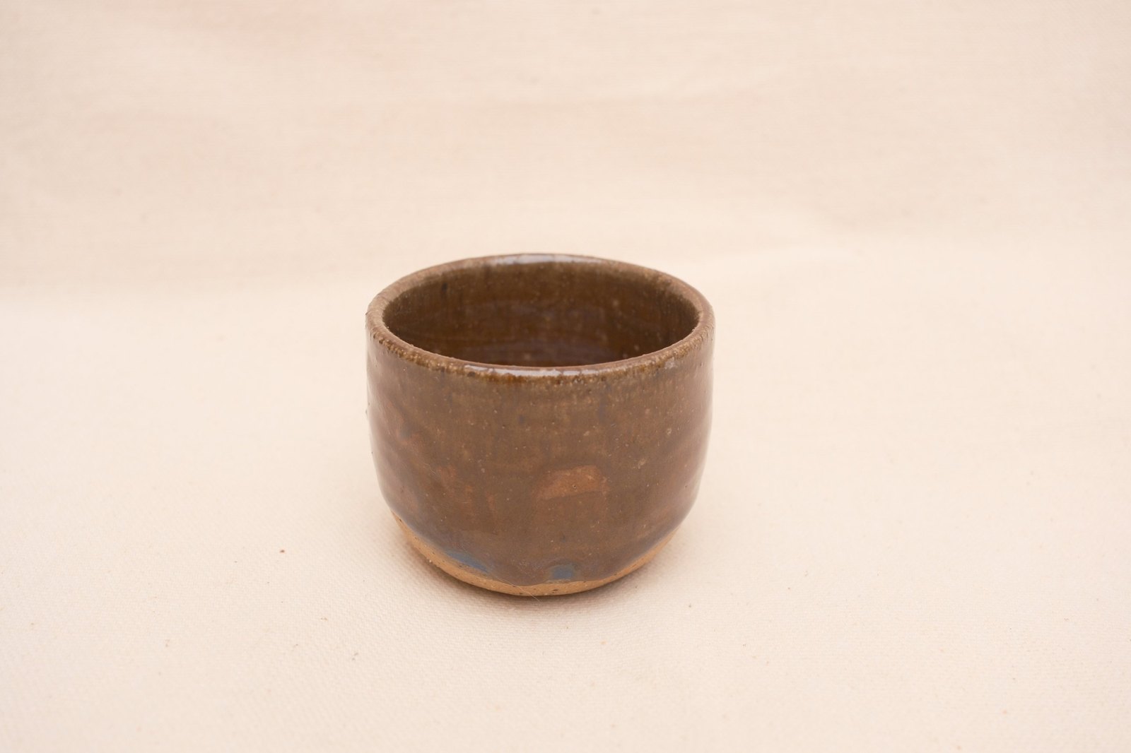 Amber cup from a slightly raised angle showing the rim