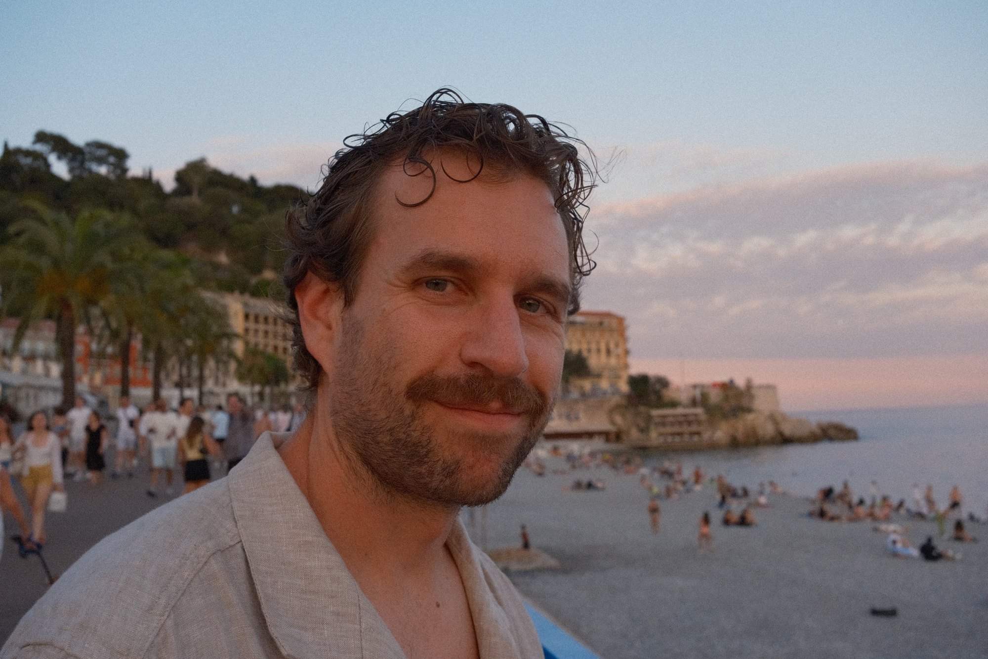 A close, warm portrait at dusk on the Promenade